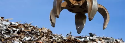 a bird flying over a pile of junk